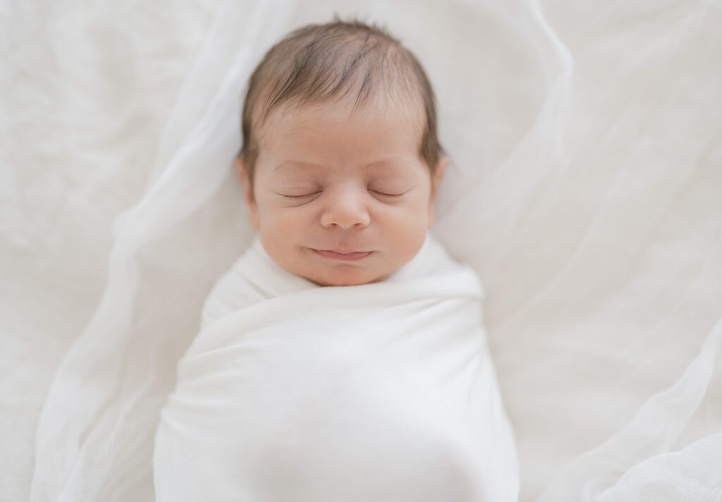 thousand oaks newborn photographer baby smiling studio session